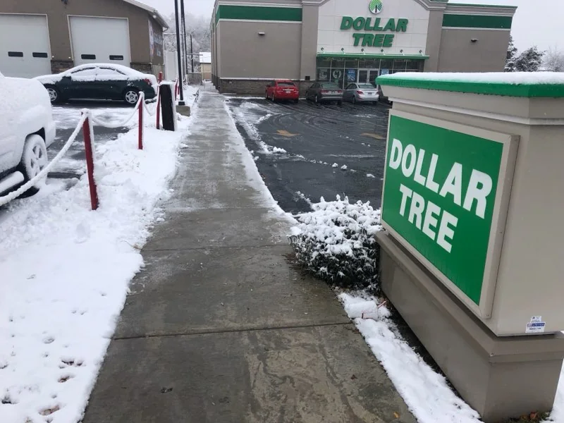 Storefront sidewalk cleared down to the concrete
